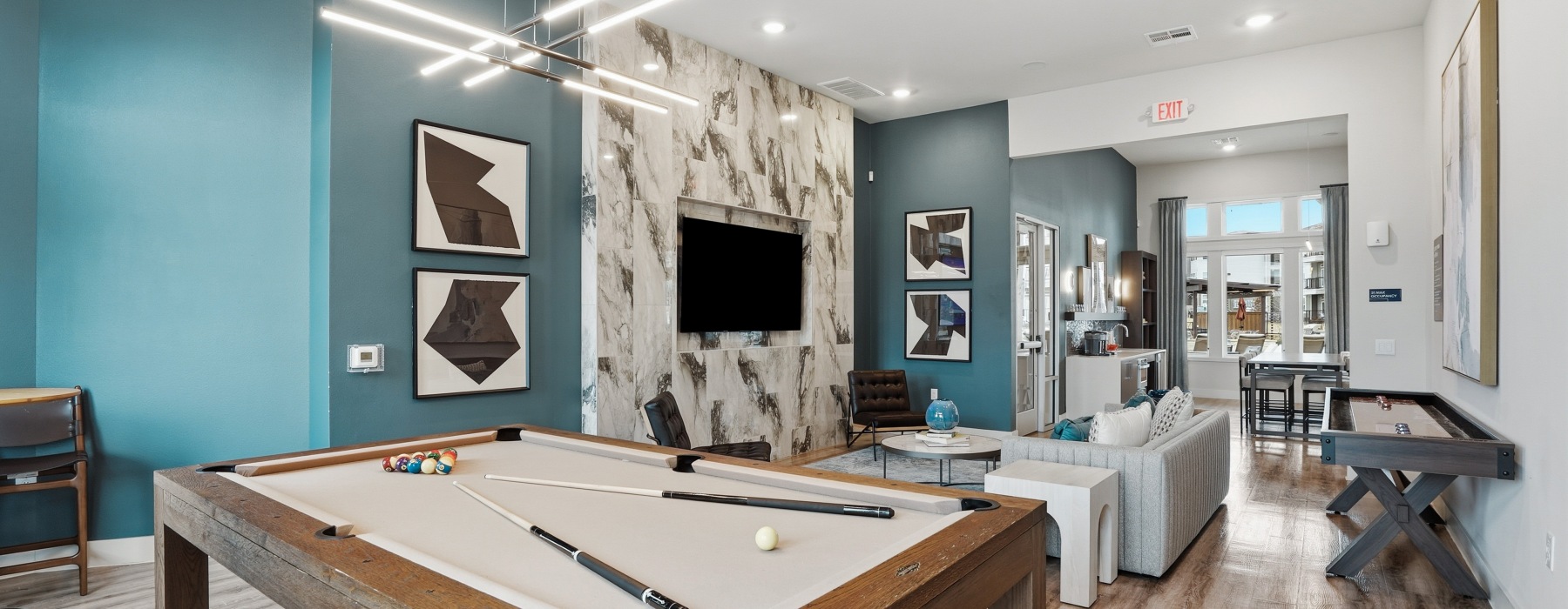 Game room with pool table and shuffleboard at Prose Prominence